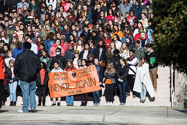 Hundreds of students at the Maggie L. Walker Governor’s School in Richmond participate in an emotional tribute to the 17 people slain at Marjory Stoneman Douglas High School in Parkland, Fla., during Wednesday’s national student walkout. 
