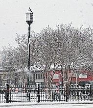 Cityscape // 
This winter scene, appearing as though from a Currier and Ives plate, was taken at Meadow and Broad streets Monday as snow powdered the city. Richmond got 2 inches of heavy, wet snow as it was brushed by a storm that slammed New England with up to 2 feet. Still, the mid-March snowfall was one of the largest Richmond has experienced ahead of the official arrival of spring on Tuesday, March 20, according to the U.S. Weather Service. The record snowfall for March 12 is the 4 inches that fell in 1910. The average snowfall for this time of year is a half inch, the weather data shows. The forecast for the next 10 days calls for continuing chilly weather. Daytime highs are predicted to be in the 40s to 50s, with nighttime lows ranging from the upper 20s to upper 30s.