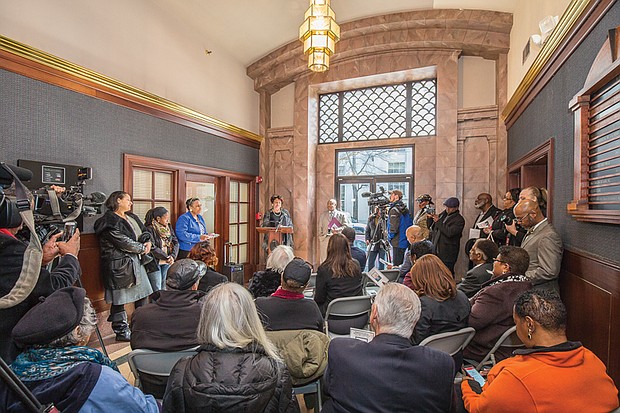 In his honor // Ahead of the unveiling, below, Councilwoman Robertson offers remembrances of the late Mr. Boone and his impact as a crusading journalist to about 75 well-wishers and reporters during a ceremony inside the Free Press building. Other speakers included Mayor Stoney, Mr. Boone and Free Press Managing Editor Bonnie V. Winston.