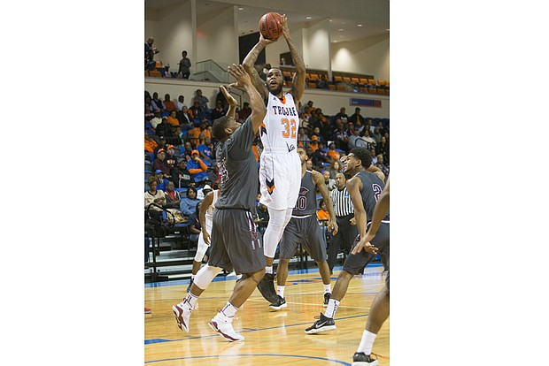 Virginia State University senior Richard Granberry goes up for a shot, helping the Trojans to their 81-76 victory over Virginia Union University last Saturday in the NCAA regionals in Ettrick. VSU would go on to lose to Shippensburg University in Sunday’s semifinal game.