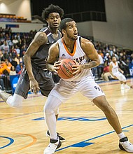 Low post operator William Vedder of Virginia State University looks for an opening after taking the ball from Virginia Union University’s William Jenkins.