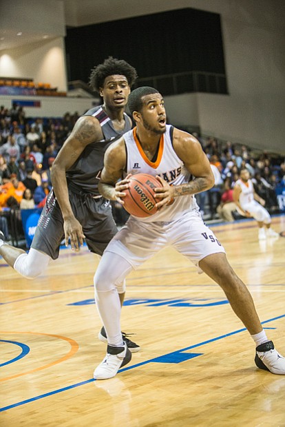 Low post operator William Vedder of Virginia State University looks for an opening after taking the ball from Virginia Union University’s William Jenkins.