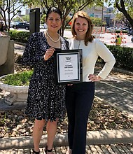 Rep. Alvarado receiving the Humane Legislator Award from the Humane Society  