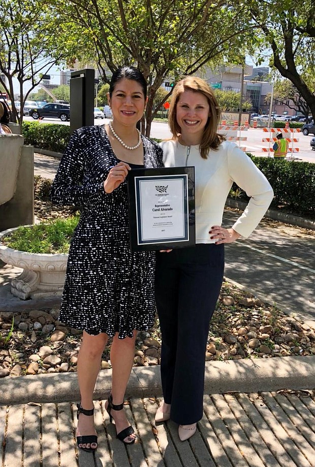 Rep. Alvarado receiving the Humane Legislator Award from the Humane Society  