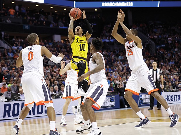 Jairus Lyles of the University of Maryland-Baltimore County goes up for a shot against the University of Virginia Cavaliers during the second half of the upset game last Friday during the NCAA Tournament’s first round in Charlotte, N.C.