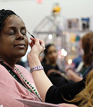 Women’s day // Rochelle Bland gets her makeup done by Elmaze of MAC Cosmetics during the Southern Women’s Show on Saturday at the Richmond Raceway Complex. 
