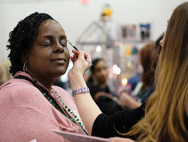 Women’s day // Rochelle Bland gets her makeup done by Elmaze of MAC Cosmetics during the Southern Women’s Show on Saturday at the Richmond Raceway Complex. 
