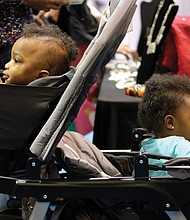 Soaking up the sights //
Fraternal twins Kayden, left, and Kallie Hunter have a lot to hold their attention during the Southern Women’s Show on Saturday at Richmond Raceway. The 18-month-old siblings were attending the event with their godmother, Amber Bebbs. Please see more photos, B3.