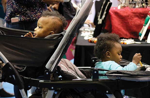 Soaking up the sights //
Fraternal twins Kayden, left, and Kallie Hunter have a lot to hold their attention during the Southern Women’s Show on Saturday at Richmond Raceway. The 18-month-old siblings were attending the event with their godmother, Amber Bebbs. Please see more photos, B3.