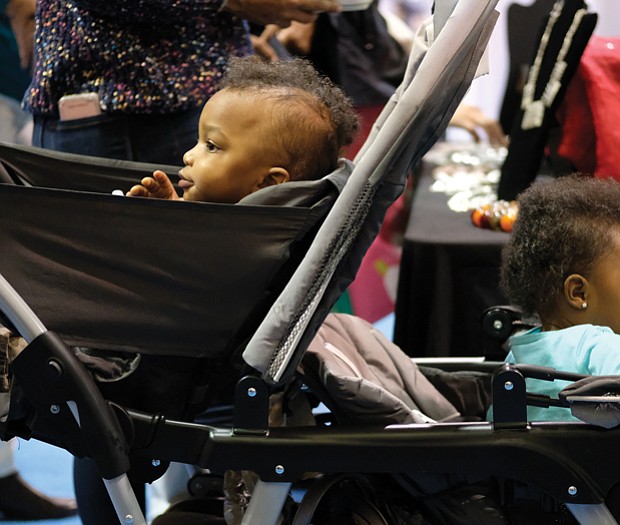 Soaking up the sights //
Fraternal twins Kayden, left, and Kallie Hunter have a lot to hold their attention during the Southern Women’s Show on Saturday at Richmond Raceway. The 18-month-old siblings were attending the event with their godmother, Amber Bebbs. Please see more photos, B3.