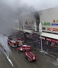 Smoke rises above a shopping center in the Siberian city of Kemerovo, about 3,600 kilometers ( approximately 2,240 miles) east of Moscow.  CREDIT: Russian Ministry for Emergency Situations/AP