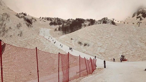 Snow appears to have an orange/reddish color in Sochi, Russia, on Saturday. The colored snow is due to sand and dust from North Africa being picked up by a storm system.