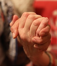 A Jewish woman clasps the hand of an undocumented woman whom she is sheltering.
Source:	Kyung Lah/CNN