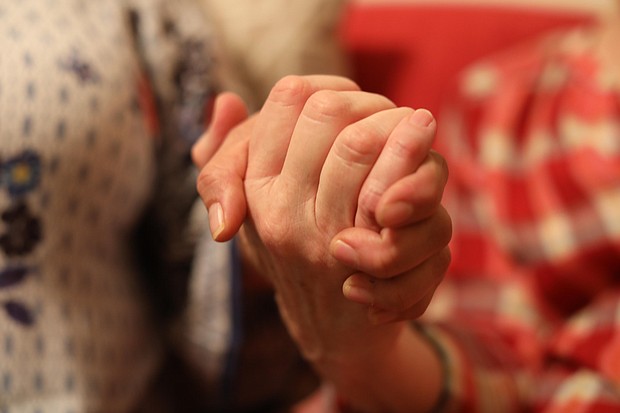 A Jewish woman clasps the hand of an undocumented woman whom she is sheltering.
Source:	Kyung Lah/CNN