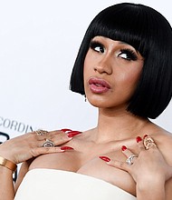 Cardi B unveiled the cover art for her debut album "Invasion of Privacy" on Instagram.