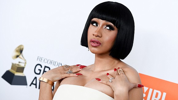 Cardi B is making money moves. The rapper on Monday unveiled the cover art for her debut album "Invasion of …