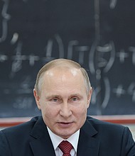 Russian President Vladimir Putin speaks during a meetng with scientists from the Russian Academy of Sciences' Siberian Branch in Novosibirsk in February./ Alexey Nikolsky/AFP/Getty Images