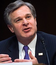 FBI Director Christopher Wray said Tuesday he is doubling the number of FBI personnel tasked with reviewing a large set of documents demanded by Republican House members related to a wide range of controversial decisions made by the FBI./Getty Images