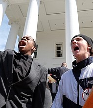 Corey Stuckey, left, an Armstrong High School freshman, and Sam Alburger, a junior at  Hermitage High School, join in a chant with the crowd of thousands at the state Capitol who turned out in Richmond last Saturday for the March for Our Lives. Corey was one of the student speakers at the rally.
