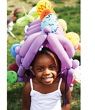 Laniyah Massenburg, 3, wears an ornate Easter bonnet made from balloons at the 2017 Easter on Parade celebration along Monument Avenue. Balloon art and bonnet making are among the activities featured in this year’s event Sunday, April 1.