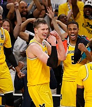 No. 3 Michigan has advanced to the national championship game with a 69-57 win over the 11th-seeded Ramblers, ending their magical run at the NCAA men's Final Four in San Antonio on Saturday./ Brynn Anderson/AP