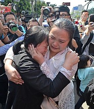 Wang Mingqing and her daughter Kang Ying