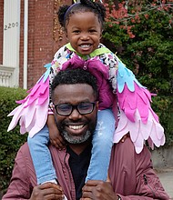 On parade //
Dr. Oshan Gadsden gives his daughter, Zuri, a heightened view of the festivities during Sunday’s Easter on Parade on Monument Avenue. The vantage point also allowed her brightly colored costume to be seen by crowds at the annual holiday event. Please see more photos, B3.