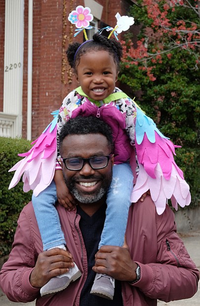 On parade //
Dr. Oshan Gadsden gives his daughter, Zuri, a heightened view of the festivities during Sunday’s Easter on Parade on Monument Avenue. The vantage point also allowed her brightly colored costume to be seen by crowds at the annual holiday event. Please see more photos, B3.