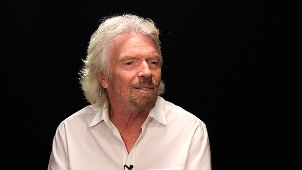 Richard Branson's spaceship fired up its rocket engine Thursday, marking the first powered test flight for the company since a fatal crash left it hamstrung in 2014.