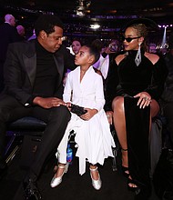 Blue Ivy Carter seated between parents Jay-Z and BeyoncÃ© at the 2018 Grammy Awards.  Full Credit: Getty Images for North America/Getty Images for NARAS
