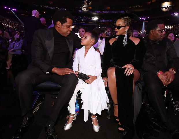 Blue Ivy Carter seated between parents Jay-Z and BeyoncÃ© at the 2018 Grammy Awards.  Full Credit: Getty Images for North America/Getty Images for NARAS