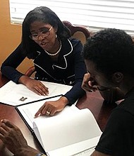 Cheryl Hudson, Co-Founder and a Sr. Academic Advisor of Xcel Scholastic, consulting with a student