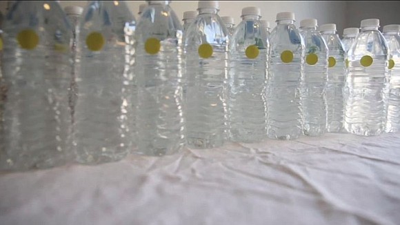 Dozens of Flint, Michigan, residents angry about the state's decision to end a free bottled water program took their outrage …