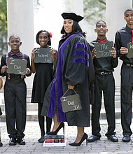 Ieshia Champs stands at center with her children (left to right) E’mani, 5, Kaleb, 8, Khassidy,11, Davien, 12, and David, 14. (Photo: Richard Holman Photography)