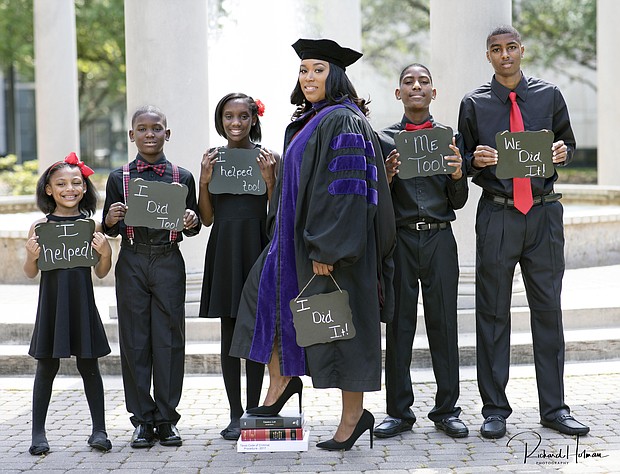 Ieshia Champs stands at center with her children (left to right)  E’mani, 5, Kaleb, 8, Khassidy,11, Davien, 12, and David, 14. (Photo: Richard Holman Photography) 
