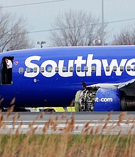 A Southwest Airlines plane flying from New York to Dallas had to make an emergency landing Tuesday morning in Philadelphia after one of its engines was damaged, according to the Federal Aviation Administration.