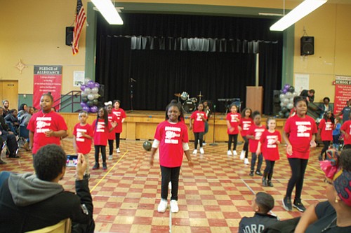 The student drill team at Martin Luther King Jr. School performs at Friday’s celebration honoring the 50 years of legacy since the school was named in honor of King.