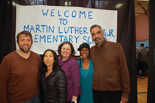 Supporters pose in front of the first sign, created by students in 1968, unveiling Martin Luther King Jr. as the new name for the former Highland School, during a 50th anniversary community celebration on Friday night honoring the school’s legacy. Shei’Meka Owens, King Parent Teacher Association president, and the daughter of Ronda Chiles, who as a sixth grade student at King 50 years ago helped lobby for the name change is pictured (second from right). Owens now has two daughters that attend King. The others pictured are King PTA leaders Paul Manson, May Wang, Megan Newell-Ching and Kenny Butler.