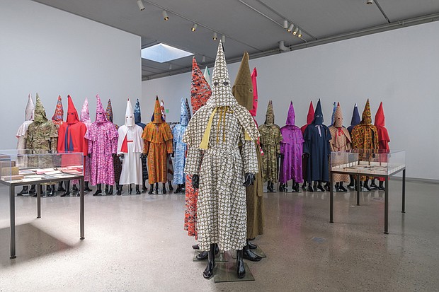 Artist Paul Rucker’s work, “Storm in the Time of Shelter,” reimagines Ku Klux Klan robes using materials such as kente cloth.