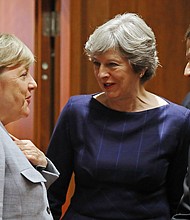 From left, German Chancellor Angela Merkel, British Prime Minister Theresa May and French President Emmanuel Macron. The three nations are calling on Trump to honor the Iran deal.  CREDIT: Dan Kitwood/Getty Images Europe/Getty Images