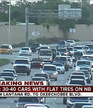 The Florida Highway Patrol said 30 vehicles experienced flat tires Monday morning on Interstate 95 northbound in Palm Beach County after steel rods fell off a semi.