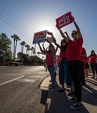 Arizona teachers protest for higher pay and more funding of schools.