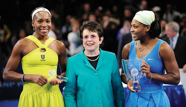 Tennis stars Venus Williams, left, and her sister, Serena, flank former tennis champion Billie Jean King in this March 2009 photo at Madison Square Garden in New York. The Williams sisters are joining the advisory board of the Billie Jean King Leadership Initiative to push for equal pay for women in all jobs.