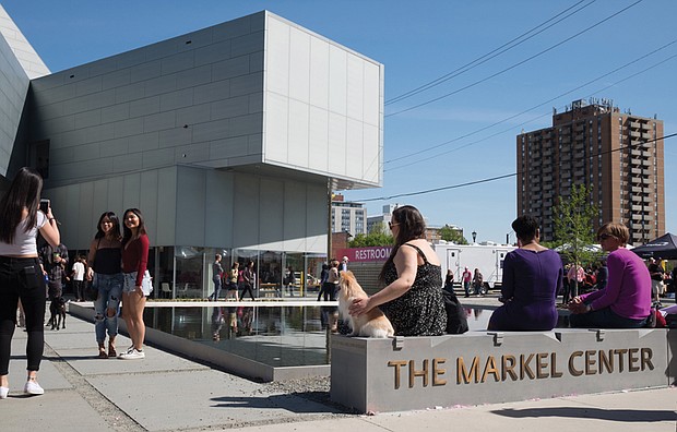 ICA grand opening // Virginia Commonwealth University students and community members join in the grand opening Saturday of the new Institute for Contemporary Art at Belvidere and Broad streets. The new 40,000-square-foot center includes a reflecting pool  where visitors lounged and enjoyed music during the opening community block party.
