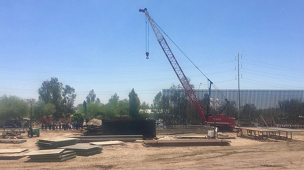 Thirty-foot steel bollard fencing goes up in Calexico, California./Tal Kopan/CNN