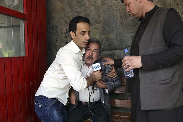 A man cries after his son was killed in an ISIS attack in Kabul, Afghanistan, Monday, April 30./AP