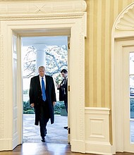 President Trump walks into The White House.