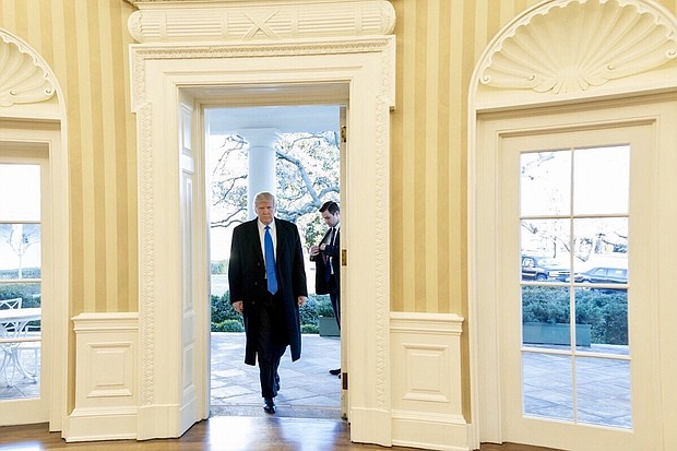 President Trump walks into The White House.