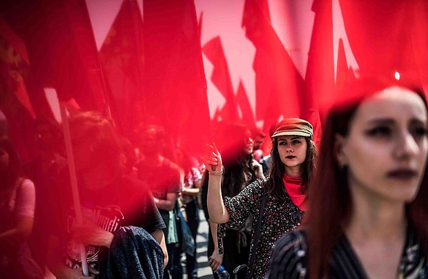 Demonstrators across the globe took to the streets on Tuesday to demand better working conditions, as part of rallies marking International Workers' Day. Seen here are demonstrators at a May Day rally in Istanbul, Turkey, on Tuesday May 1.