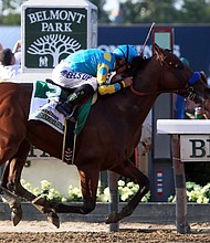 Kentucky Derby and Preakness Stakes winner American Pharoah wins the 147th running of the Belmont Stakes